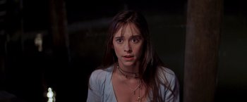 Movie still from “I Know What You Did Last Summer” (1997), directed by Jim Gillespie – A woman with long brown hair wearing a white shirt; Close Up shot, High angle