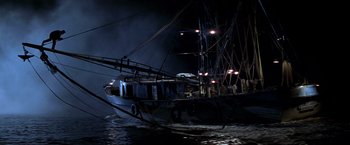 Movie still from “I Know What You Did Last Summer” (1997), directed by Jim Gillespie – A boat in the water at night with lights on it; Extreme Wide shot, Low angle
