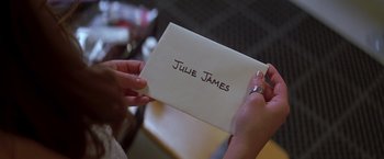 Movie still from “I Know What You Did Last Summer” (1997), directed by Jim Gillespie – A person holding a piece of paper with a name written on it; Close Up shot, Overhead angle