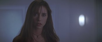 Movie still from “I Know What You Did Last Summer” (1997), directed by Jim Gillespie – A beautiful young woman with long brown hair and blue eyes; Close Up shot, Low angle