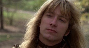 Movie still from “Hair” (1979), directed by Milos Forman – A person with long blonde hair; Close Up shot, Low angle