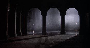 Movie still from “Hair” (1979), directed by Milos Forman – A view of a building from the inside looking out; Extreme Wide shot, Low angle