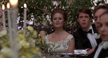 Movie still from “Hair” (1979), directed by Milos Forman – A man and a woman sitting at a dinner table; Close Up shot, Low angle