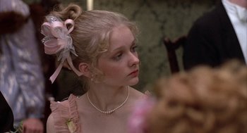 Movie still from “Hair” (1979), directed by Milos Forman – A young woman in a pink dress looking into a mirror; Close Up shot, Over the shoulder angle