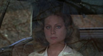 Movie still from “Hair” (1979), directed by Milos Forman – A person holding an open umbrella; Close Up shot, High angle