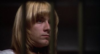 Movie still from “Hair” (1979), directed by Milos Forman – A person with long blonde hair; Close Up shot, Low angle