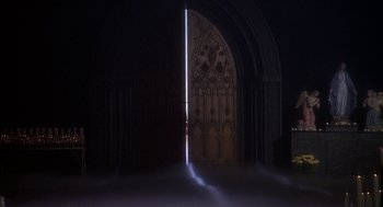 Movie still from “Hair” (1979), directed by Milos Forman – A door that is opened to a room with light coming through it; Extreme Wide shot, High angle