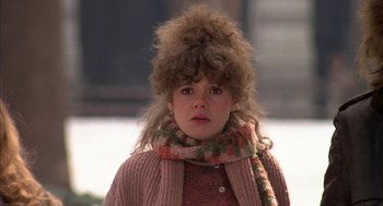 Movie still from “Hair” (1979), directed by Milos Forman – A young woman with a messy hair style; Close Up shot, Low angle