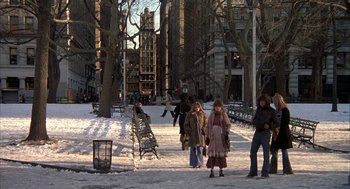 Movie still from “Hair” (1979), directed by Milos Forman – A group of people walking on a snowy sidewalk; Wide shot, High angle