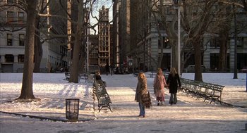 Movie still from “Hair” (1979), directed by Milos Forman – A group of people walking in a park near benches; Extreme Wide shot, High angle