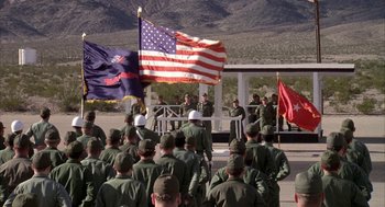 Movie still from “Hair” (1979), directed by Milos Forman – A group of soldiers standing next to each other on top of a hill; Extreme Wide shot, High angle