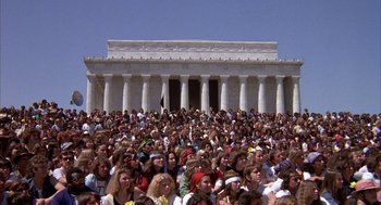 Movie still from “Hair” (1979), directed by Milos Forman – A crowd of people standing in front of the lincoln memorial; Extreme Wide shot, High angle