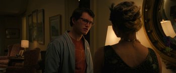 Movie still from “Halloween Ends” (2022), directed by David Gordon Green – A man and a woman standing next to each other in a room; Medium shot, Over the shoulder angle