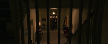 Movie still from “Halloween Ends” (2022), directed by David Gordon Green – A person sitting at a piano in a living room; Extreme Wide shot, High angle