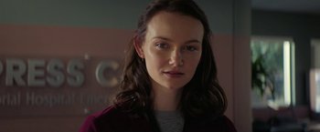 Movie still from “Halloween Ends” (2022), directed by David Gordon Green – A person with long hair; Close Up shot, Over the shoulder angle