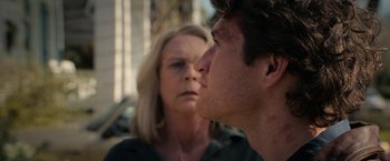 Movie still from “Halloween Ends” (2022), directed by David Gordon Green – A man and a woman looking at one another; Close Up shot, Over the shoulder angle