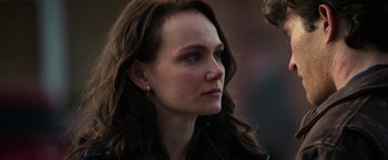 Movie still from “Halloween Ends” (2022), directed by David Gordon Green – A person with long brown hair; Close Up shot, Over the shoulder angle