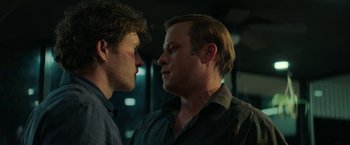 Movie still from “Halloween Ends” (2022), directed by David Gordon Green – Two men standing next to each other in front of a building; Close Up shot, Over the shoulder angle