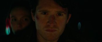 Movie still from “Halloween Ends” (2022), directed by David Gordon Green – A person's face in the dark; Extreme Close Up shot, High angle