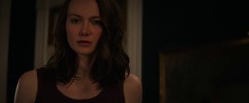 Movie still from “Halloween Ends” (2022), directed by David Gordon Green – A person with long brown hair; Close Up shot, Over the shoulder angle