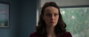 Movie still from “Halloween Ends” (2022), directed by David Gordon Green – A person with long brown hair; Close Up shot, Over the shoulder angle