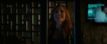 Movie still from “Halloween Ends” (2022), directed by David Gordon Green – A woman with long red hair is looking up; Close Up shot, Low angle