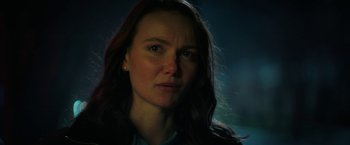 Movie still from “Halloween Ends” (2022), directed by David Gordon Green – A person with long hair; Close Up shot, Over the shoulder angle