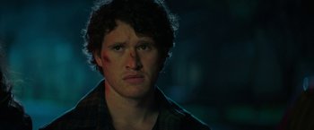 Movie still from “Halloween Ends” (2022), directed by David Gordon Green – A person wearing a plaid shirt; Close Up shot, Low angle