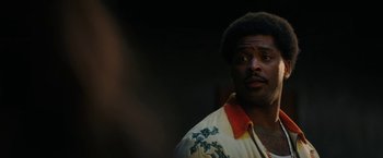 Movie still from “Halloween Ends” (2022), directed by David Gordon Green – A person wearing a jacket; Close Up shot, Over the shoulder angle