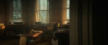 Movie still from “Halloween Ends” (2022), directed by David Gordon Green – A living room filled with lots of furniture and windows; Extreme Wide shot, High angle
