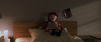 Movie still from “Halloween: Resurrection” (2002), directed by Rick Rosenthal – A doll sitting on top of a pillow on top of a bed; Extreme Close Up shot, High angle
