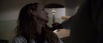 Movie still from “Halloween: Resurrection” (2002), directed by Rick Rosenthal – A woman getting her hair cut at a hair salon; Close Up shot, Low angle