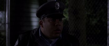 Movie still from “Halloween: Resurrection” (2002), directed by Rick Rosenthal – A police officer wearing a uniform and a hat; Close Up shot, Low angle