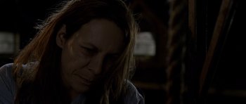 Movie still from “Halloween: Resurrection” (2002), directed by Rick Rosenthal – A person with long brown hair; Close Up shot, High angle