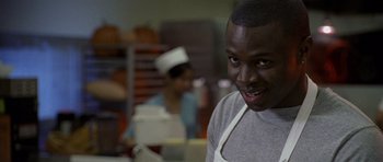 Movie still from “Halloween: Resurrection” (2002), directed by Rick Rosenthal – A man wearing an apron in a restaurant kitchen; Close Up shot, Low angle