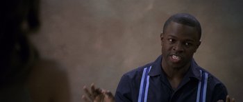 Movie still from “Halloween: Resurrection” (2002), directed by Rick Rosenthal – A man in a blue shirt is talking to someone; Close Up shot, Over the shoulder angle