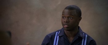 Movie still from “Halloween: Resurrection” (2002), directed by Rick Rosenthal – A man in a blue shirt is looking to his left; Close Up shot, Over the shoulder angle