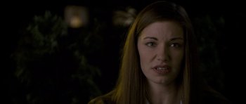 Movie still from “Halloween: Resurrection” (2002), directed by Rick Rosenthal – A person with long brown hair; Close Up shot, Over the shoulder angle