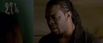 Movie still from “Halloween: Resurrection” (2002), directed by Rick Rosenthal – A person with dreadlocks; Close Up shot, Over the shoulder angle