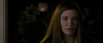 Movie still from “Halloween: Resurrection” (2002), directed by Rick Rosenthal – A person with long brown hair; Close Up shot, Over the shoulder angle