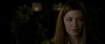 Movie still from “Halloween: Resurrection” (2002), directed by Rick Rosenthal – A person with long brown hair; Close Up shot, Over the shoulder angle