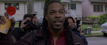 Movie still from “Halloween: Resurrection” (2002), directed by Rick Rosenthal – A person with dreadlocks wearing a jacket; Close Up shot, Low angle