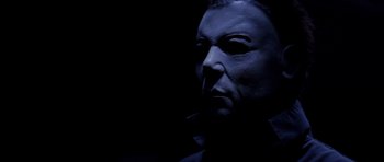 Movie still from “Halloween: Resurrection” (2002), directed by Rick Rosenthal – A person wearing a mask; Close Up shot, Low angle