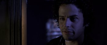 Movie still from “Halloween: Resurrection” (2002), directed by Rick Rosenthal – A person wearing a black jacket; Close Up shot, Over the shoulder angle