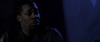 Movie still from “Halloween: Resurrection” (2002), directed by Rick Rosenthal – A man in a dark room with his eyes closed; Close Up shot, Low angle