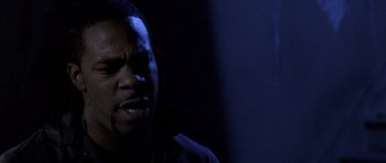 Movie still from “Halloween: Resurrection” (2002), directed by Rick Rosenthal – A man with a beard is looking at the camera; Close Up shot, Low angle