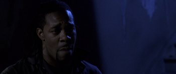 Movie still from “Halloween: Resurrection” (2002), directed by Rick Rosenthal – A man in a dark room with his eyes wide open; Close Up shot, Low angle