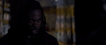 Movie still from “Halloween: Resurrection” (2002), directed by Rick Rosenthal – A person wearing a black shirt; Close Up shot, Low angle