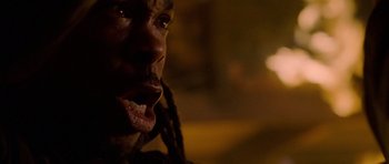 Movie still from “Halloween: Resurrection” (2002), directed by Rick Rosenthal – A man's face with long dreadlocks; Extreme Close Up shot, Low angle