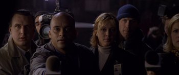 Movie still from “Halloween: Resurrection” (2002), directed by Rick Rosenthal – A group of people standing next to each other in the dark; Close Up shot, Low angle